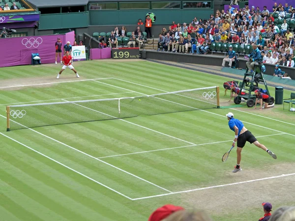 Roger Federer and John Isner — Stock Photo, Image