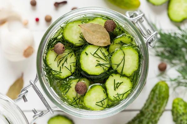 Pickled cucumbers closeup in a jar. Top view. — Stock Image Pickled cucumbers closeup in a jar. Top view. Stock Picture