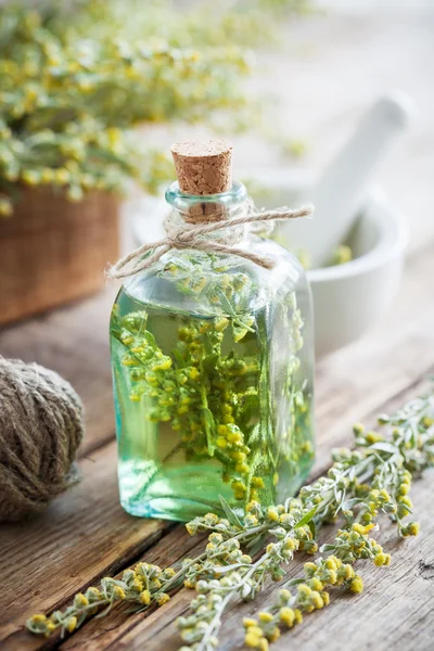 Bottle of absent or tincture of tarragon healthy herbs, absinth — Stock Photo, Image