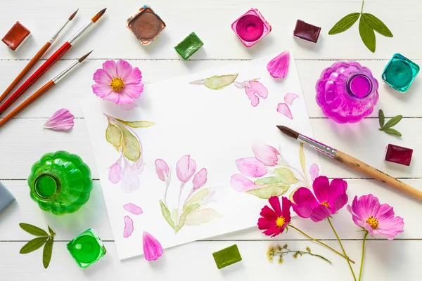 Watercolor paints, brushes, flowers and watercolor sketch. — Stock Photo, Image