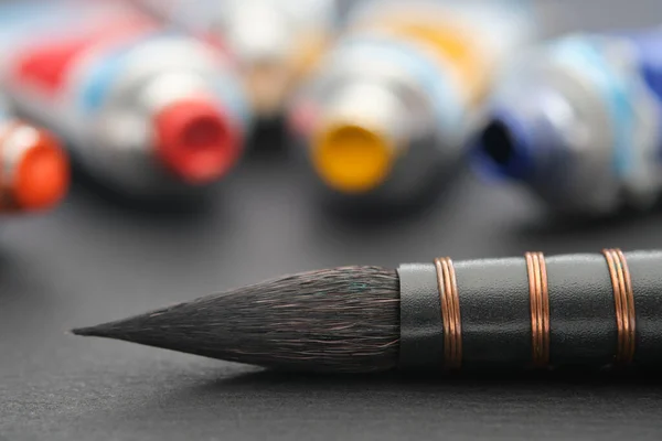 Artistic Paintbrush Watercolor Painting Closeup Black Paper Sheet Sketchbook Tubes — Stock Photo, Image