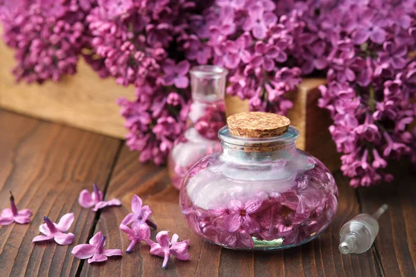 Bottles Oil Infusion Purple Lilac Flowers Wooden Table — 스톡 사진