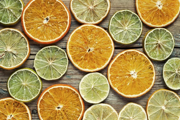 Dried orange and lemon slices on wooden table. — Stock Photo, Image