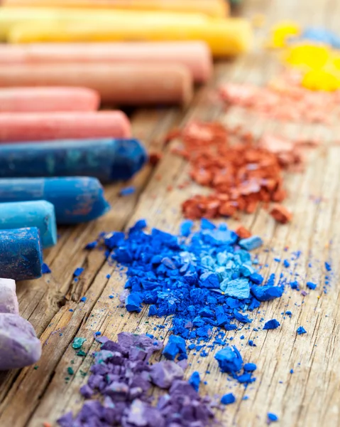 Premium Photo  Collection of rainbow colored artistic pastel crayons with  pigment dust on old wooden desk