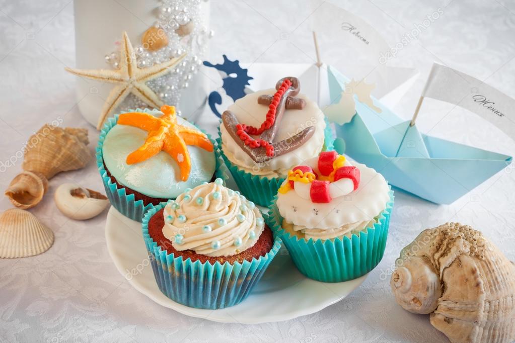 Wedding still life - cupcakes in nautical style, paper boats, vi