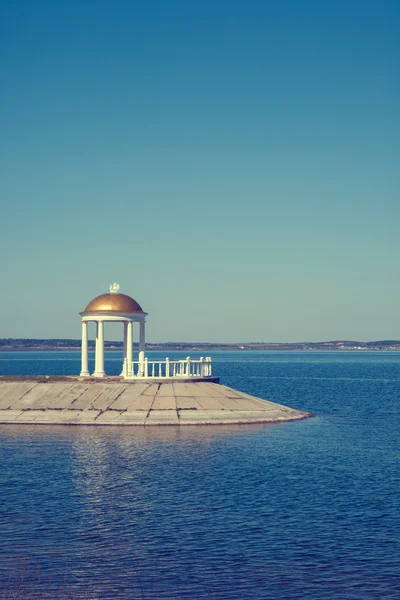 Classic gazebo with column on shore — Stock Image Classic gazebo with column on shore Royalty Free Stock Photos