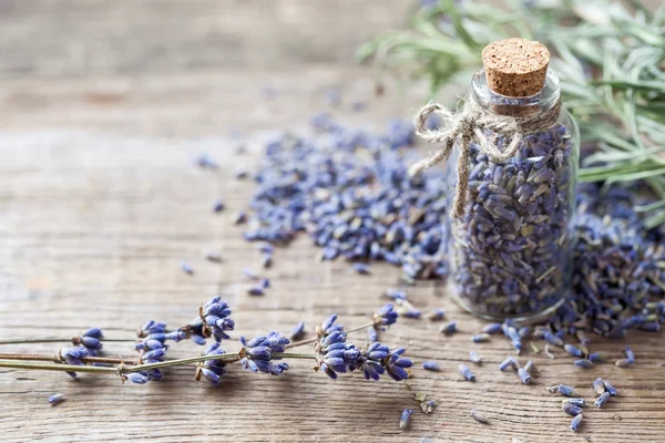 Bottle of dry lavender flowers. Selective focus. — Stock Photo, Image