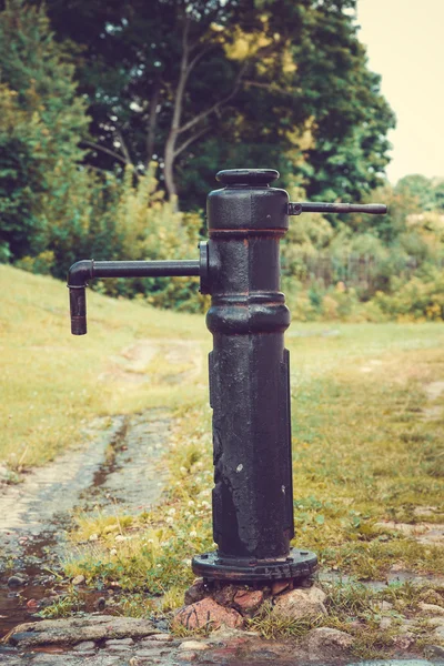 Drinking water fountain with hand pump . — Stock Photo, Image