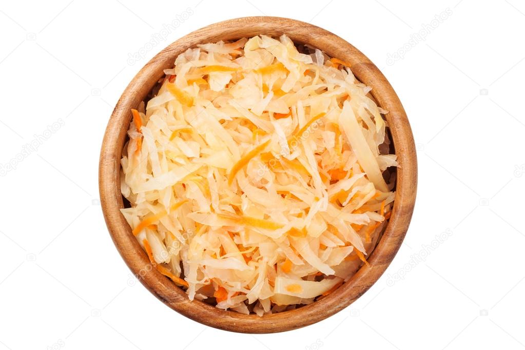 Cabbage salad in wooden bowl, top view.