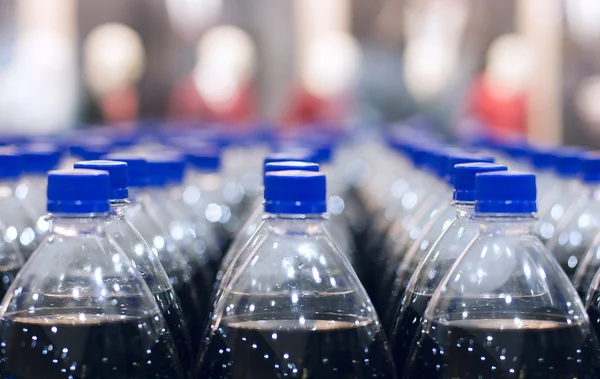 Plastic bottles in stock — Stock Photo, Image