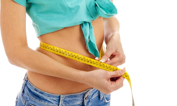 Slim girl measuring waist centimete — Stock Photo, Image