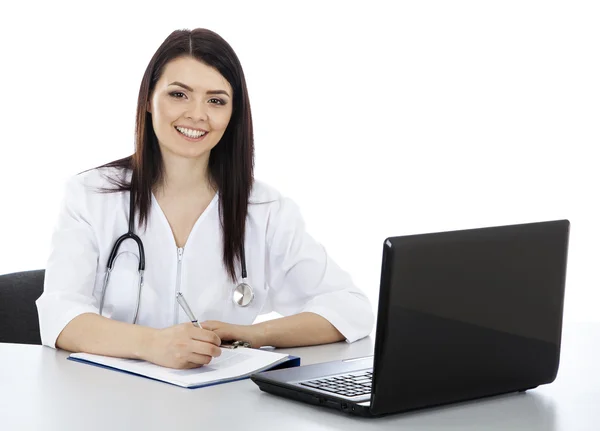 Tablo ve yazma oturan güzel kadın doktor.