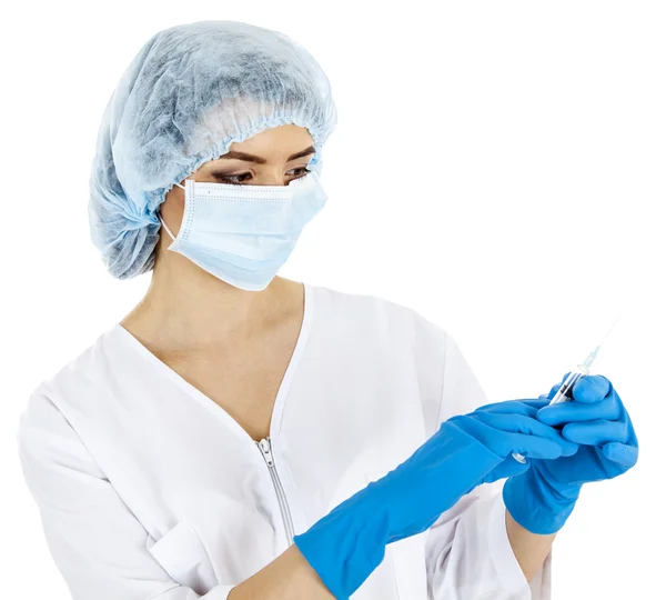 Beautiful woman doctor preparing a syringe for an injection — Stock Photo, Image