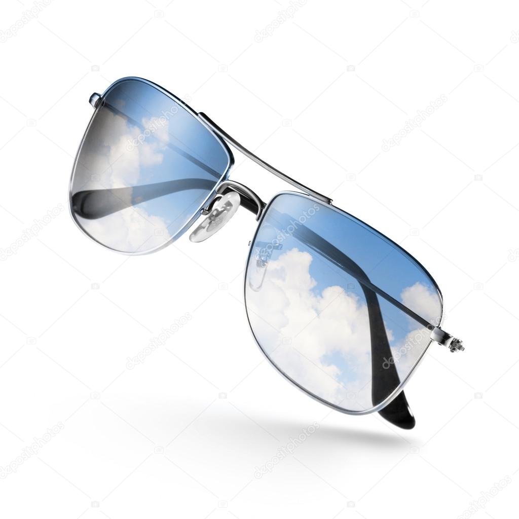 sunglasses with sky in reflection isolated on white