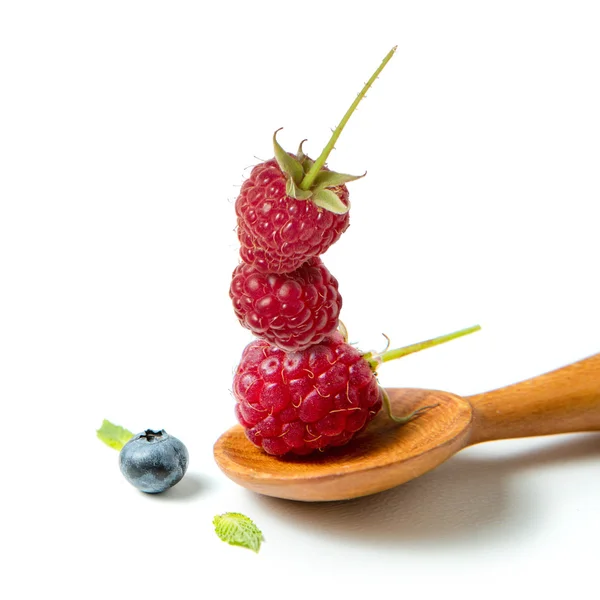 Raspberry in wooden spoon — Stock Photo, Image