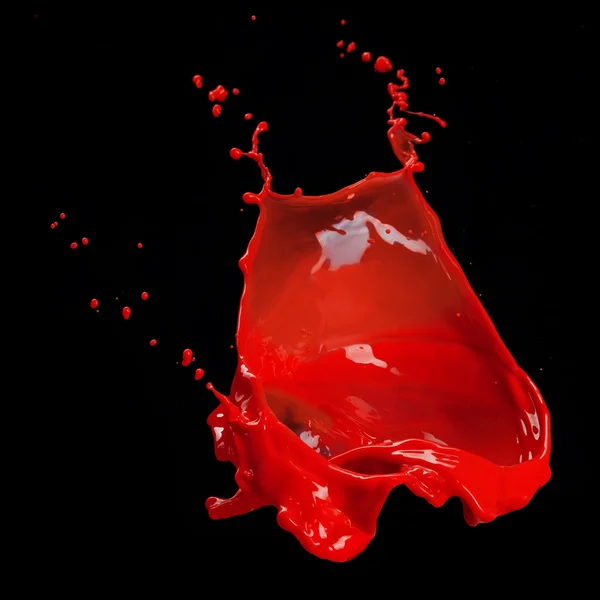 Respingo de tinta vermelha isolada em preto — Fotografia de Stock