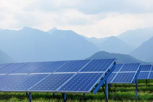 Solar panels against mountains — Stock Photo, Image