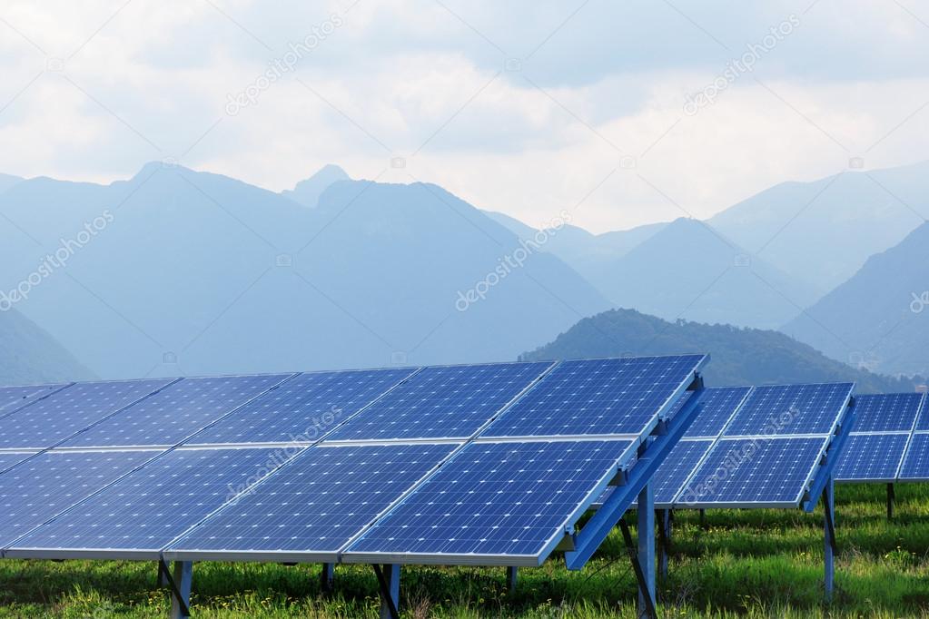 solar panels against mountains