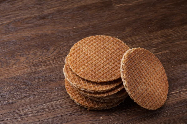 Waffles with caramel on wood — Stock Photo, Image