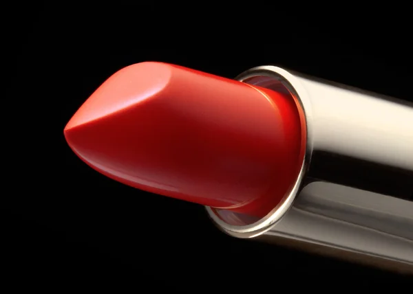 Red lipstick isolated on black — Stock Photo, Image