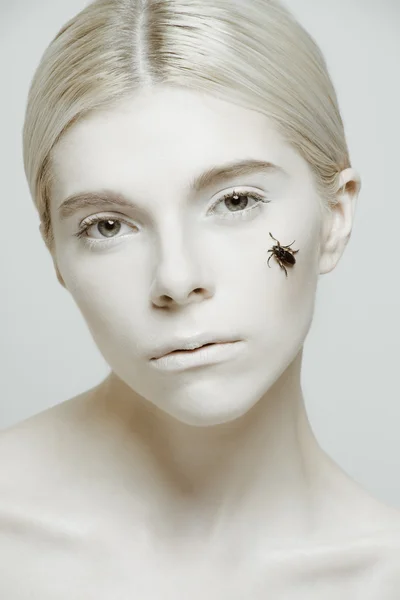 Beauty Portrait of model with insect on her face — Stock Photo, Image