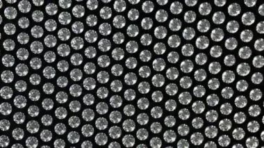 Malzeme elmas ya da taşlar ile sallayarak