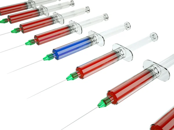 Red syringe among blue — Stock Photo, Image