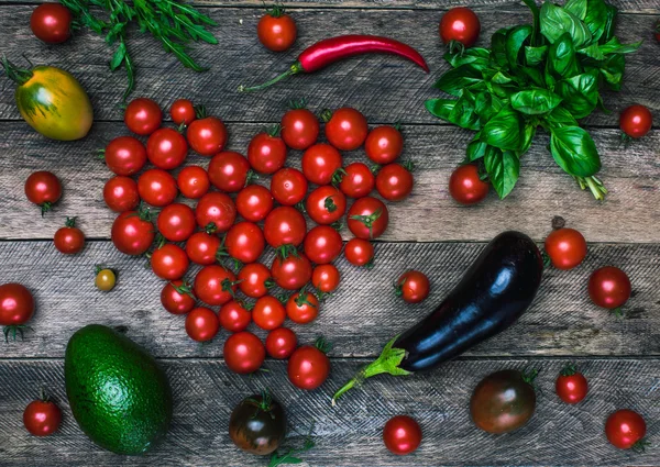 Tomato heart shape and vegetables — Stock Photo, Image