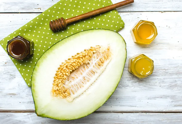 Healthy melon with honey on napkin — Stock Photo, Image