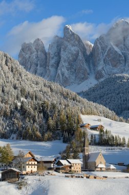 Dolomites village in winter clipart