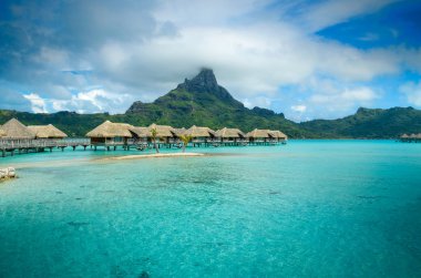 Luxury thatched roof bungalow resort on Bora Bora