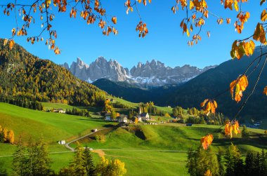 Dolomites mountain village in autumn clipart