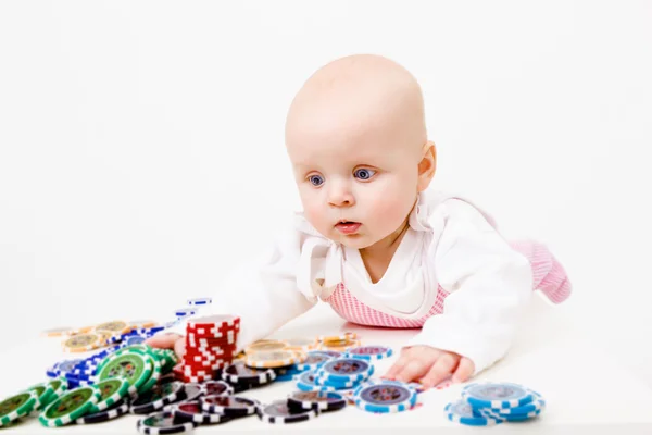 Infant with chips from the casino — Stock Photo, Image