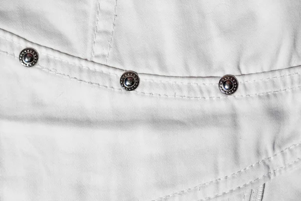 Een deel van de witte jeans. macro foto — Stockfoto