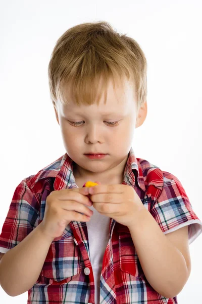 Little boy standing with toy. studio — Stock Photo, Image