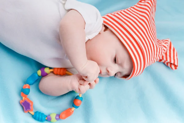 Baby in hat lying — Stock Photo, Image