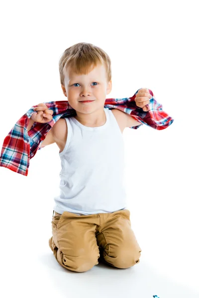 Little boy in a plaid shirt over a white — Stock Photo, Image