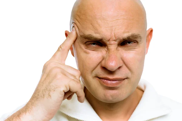 Man met zijn vinger aan zijn tempel. Hoofdpijn of probleem — Stockfoto