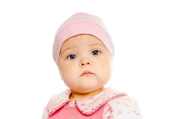 Bambino serio in un cappello rosa su sfondo bianco — Foto Stock