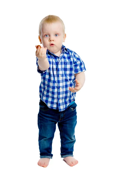 Niño en una camisa a cuadros en pleno crecimiento —  Fotos de Stock