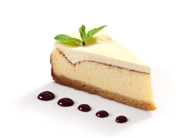 cheesecake slice decorated with mint leaf
