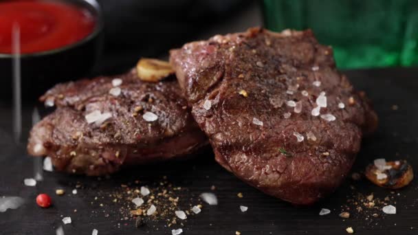 Salt Spices Falling Freshly Grilled Beef Fillet Steak Black Stone — Stock Video