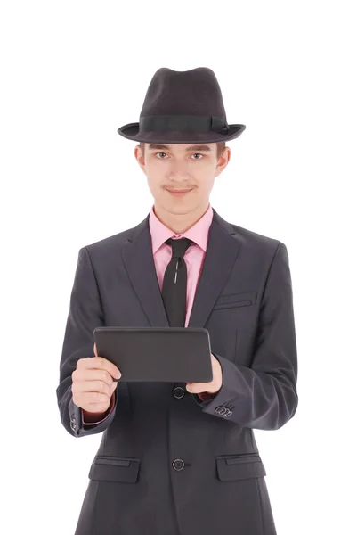 Niño en un traje negro sostener una tableta PC —  Fotos de Stock