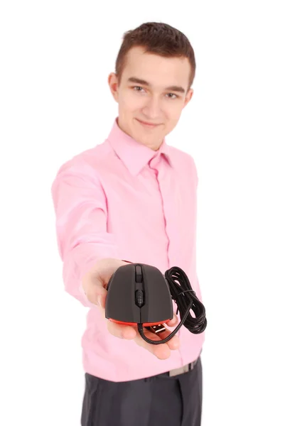 Young man holds in his hand black computer optical mouse — Stock Photo, Image