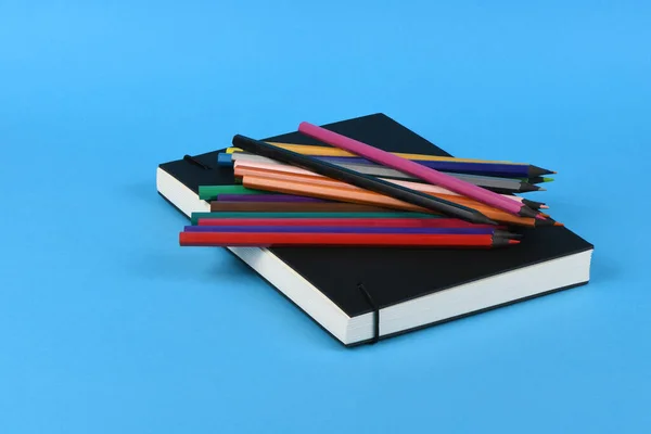 Side View Workplace Pencils Notebook Blue Background High Resolution Photo — Stock Photo, Image