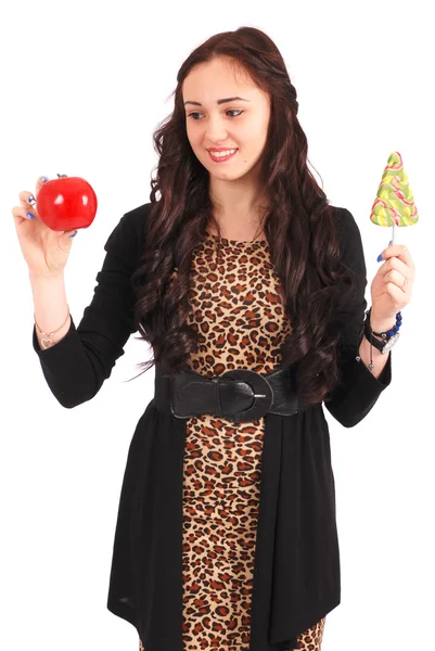 Tiener meisje met een lolly en een apple — Stockfoto