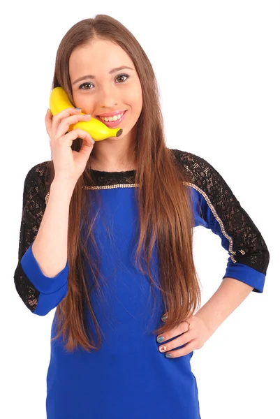 Девочка с банановым телефоном — стоковое фото