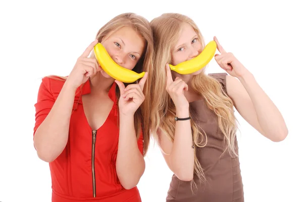 Dos hermosa joven caucásica chica con plátano sonrisa —  Fotos de Stock