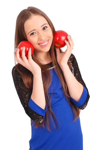 Молода дівчина тримає біля обличчя яблука — стокове фото
