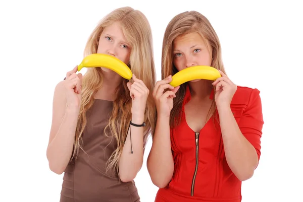 Dos hermosa joven caucásica chica con plátano sonrisa —  Fotos de Stock
